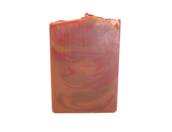Brown and red swirled bar soap on white background